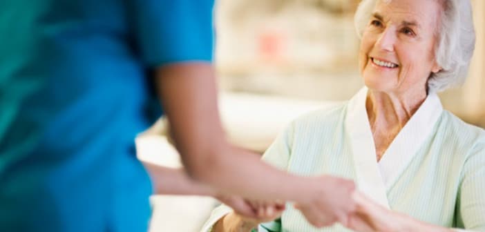 Nurse Holding Hands with Elderly Patient